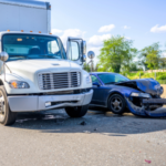 Road accident with damage to vehicles as a result of a collision between a semi truck with box trailer and a car